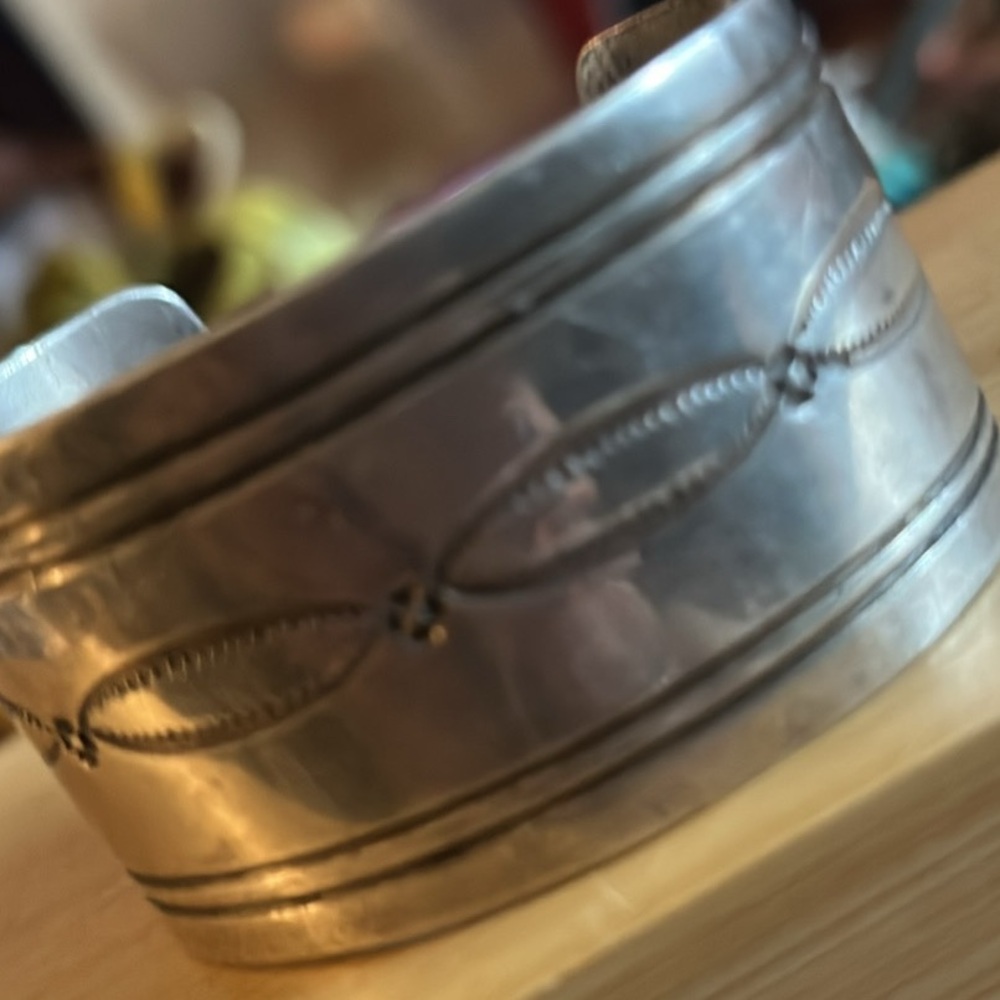 Vintage Navajo sterling silver cuff bracelet featuring hand-stamped designs.